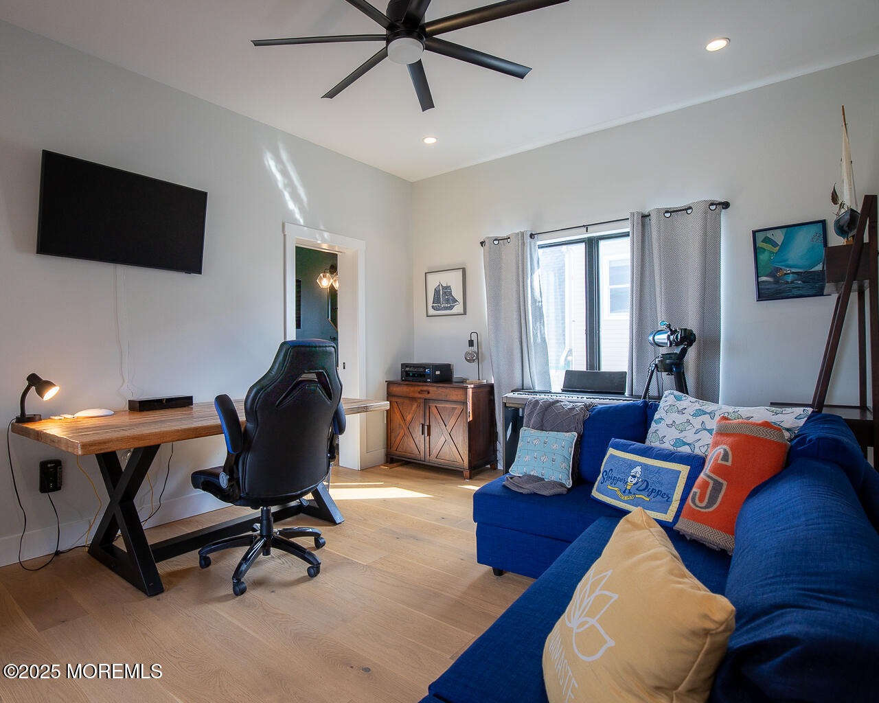 637 Cedar Run Dock Road West Creek, NJ 08092 - Photo 31 of 51 a workspace with a flat screen tv and a window