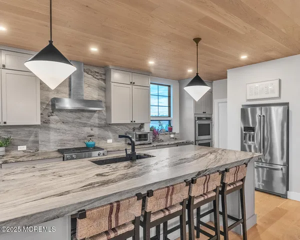 a view of a kitchen and dining room