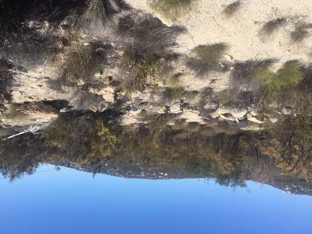 a view of a mountain range in a cloudy sky