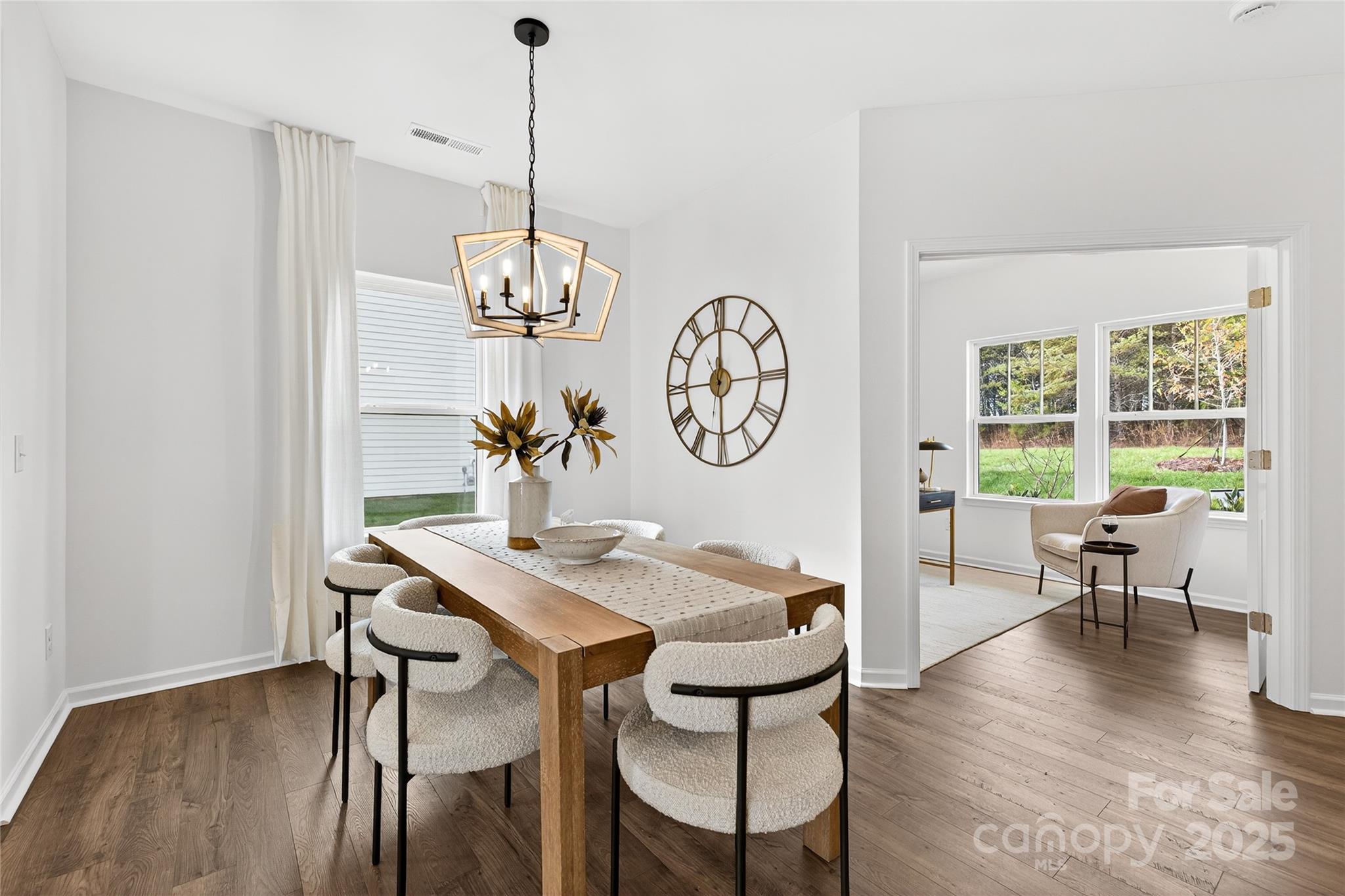 10423 Lakeshore Drive, Unit 71 Lancaster, SC 29720 - Photo 11 of 31 a view of a dining room with furniture window and wooden floor