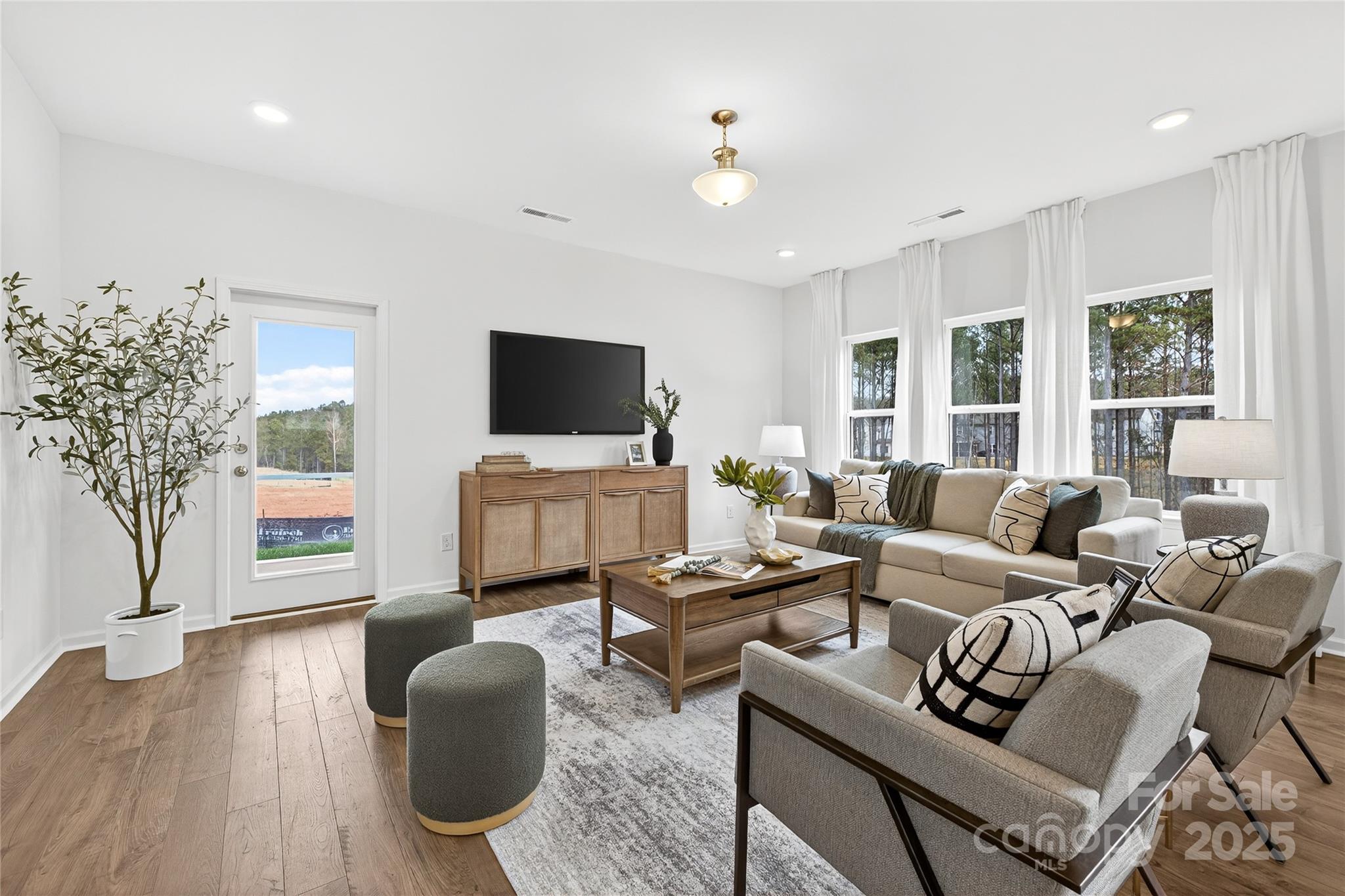 10423 Lakeshore Drive, Unit 71 Lancaster, SC 29720 - Photo 12 of 31 a living room with furniture and a flat screen tv
