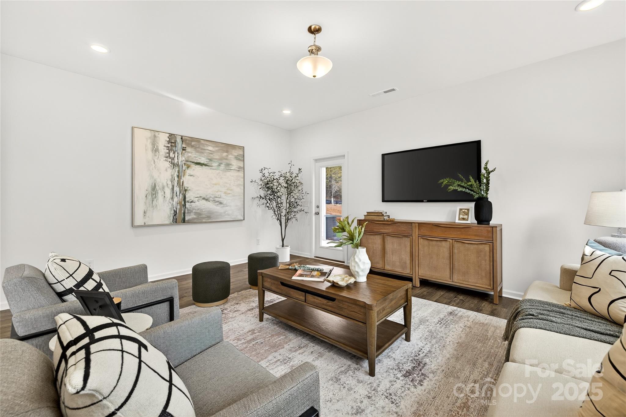 10423 Lakeshore Drive, Unit 71 Lancaster, SC 29720 - Photo 14 of 31 a living room with furniture and a flat screen tv