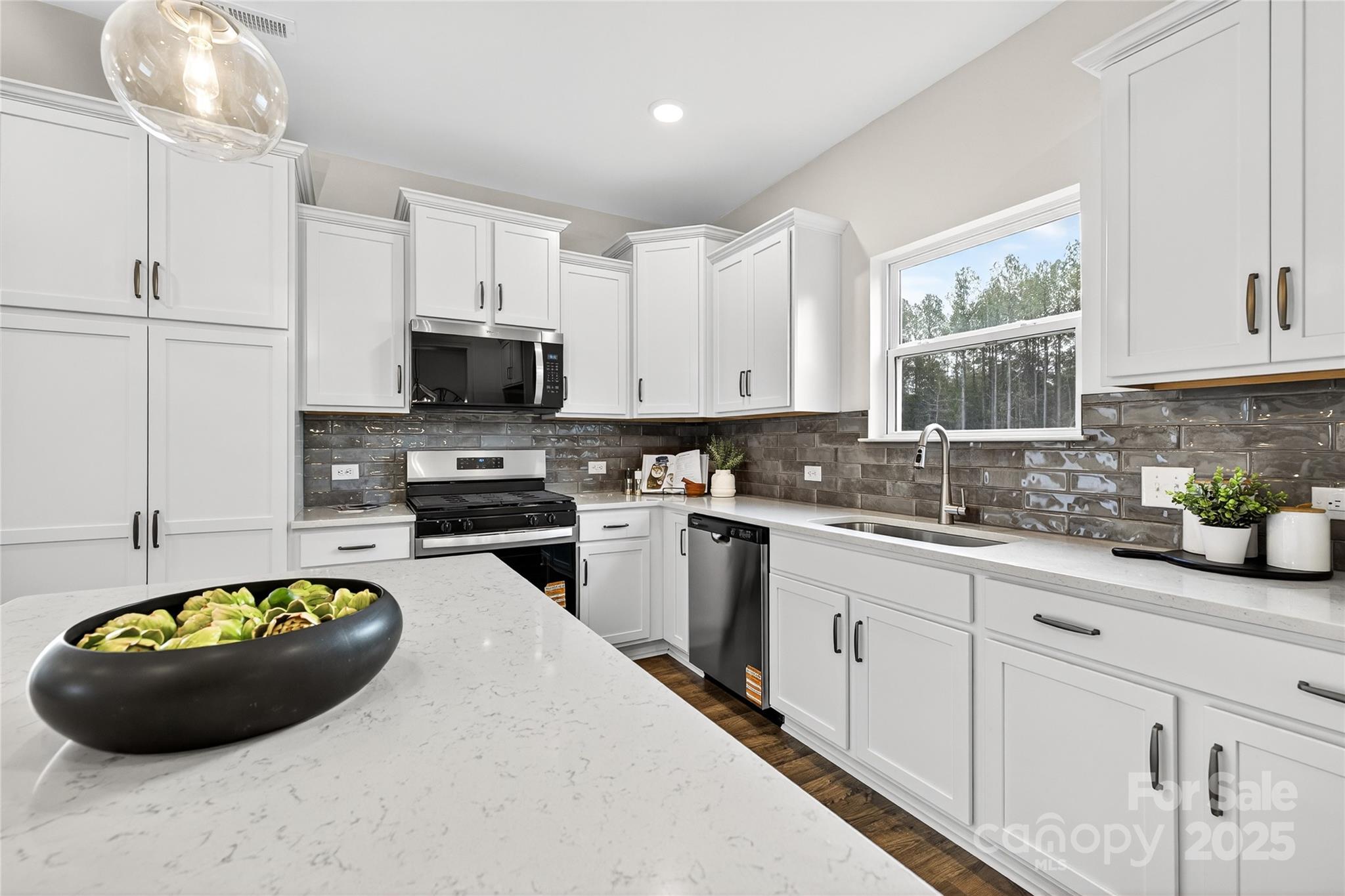 10423 Lakeshore Drive, Unit 71 Lancaster, SC 29720 - Photo 8 of 31 a kitchen with a sink a stove and cabinets