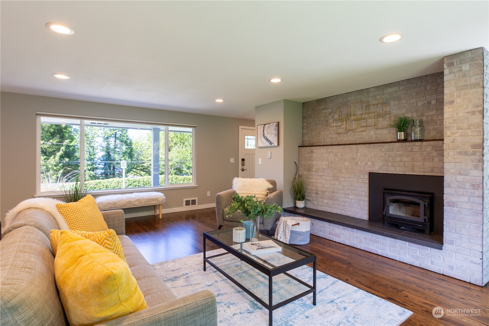 8498 Talbot Road Edmonds, WA 98026 - Photo 11 of 30 a living room with furniture and a fireplace