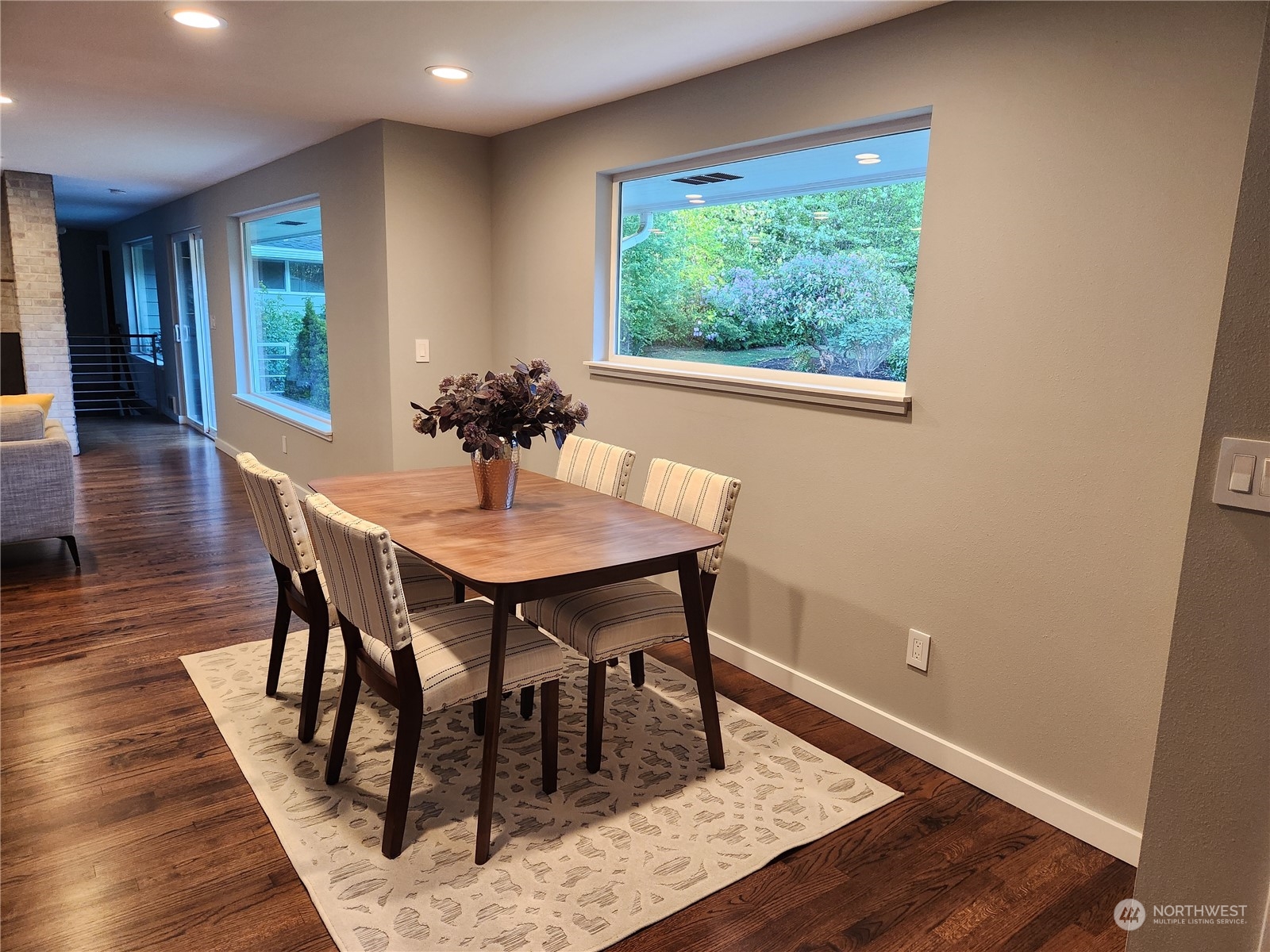 8498 Talbot Road Edmonds, WA 98026 - Photo 13 of 30 a view of a dining room with furniture window and wooden floor