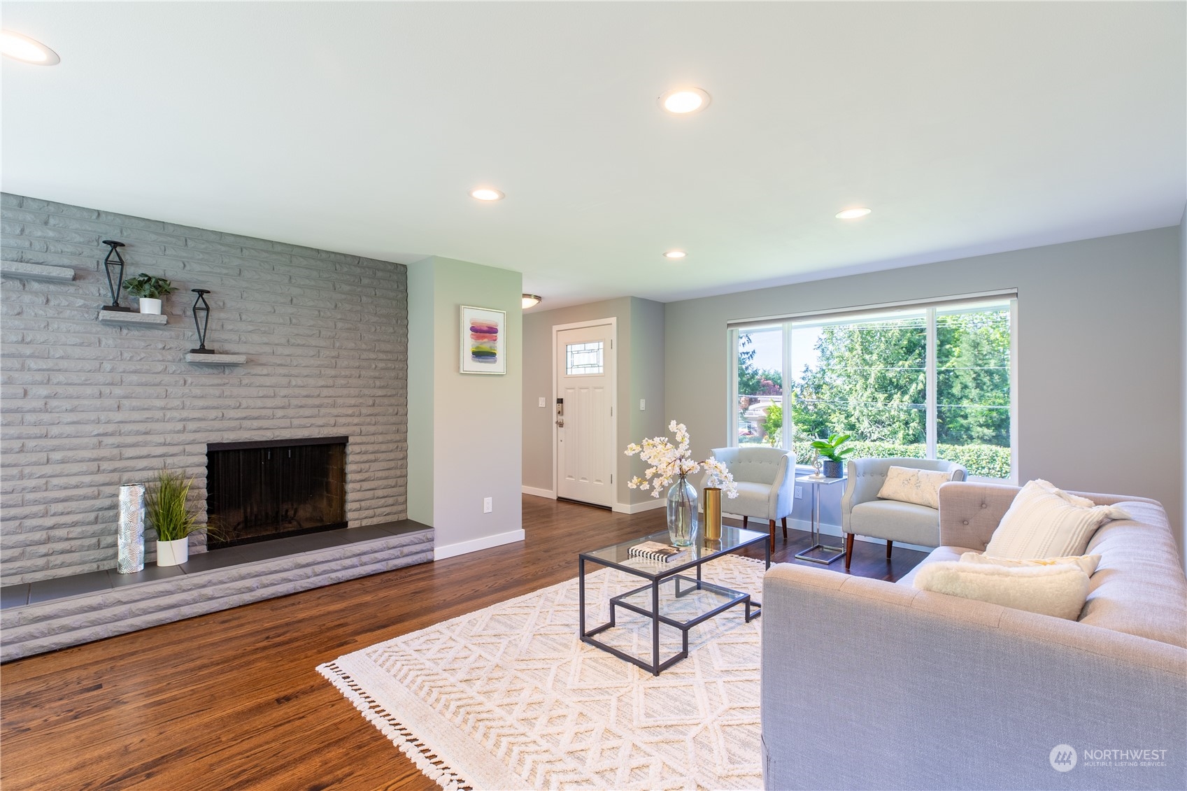 8498 Talbot Road Edmonds, WA 98026 - Photo 17 of 30 a living room with furniture and a fireplace