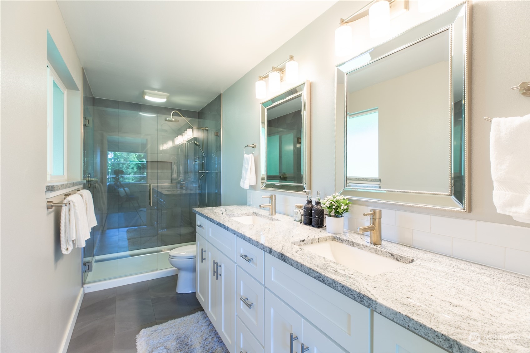 8498 Talbot Road Edmonds, WA 98026 - Photo 19 of 30 a bathroom with a granite countertop sink mirror and shower