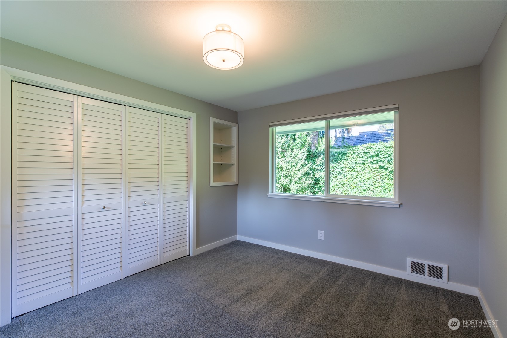 8498 Talbot Road Edmonds, WA 98026 - Photo 21 of 30 a view of an empty room with a window