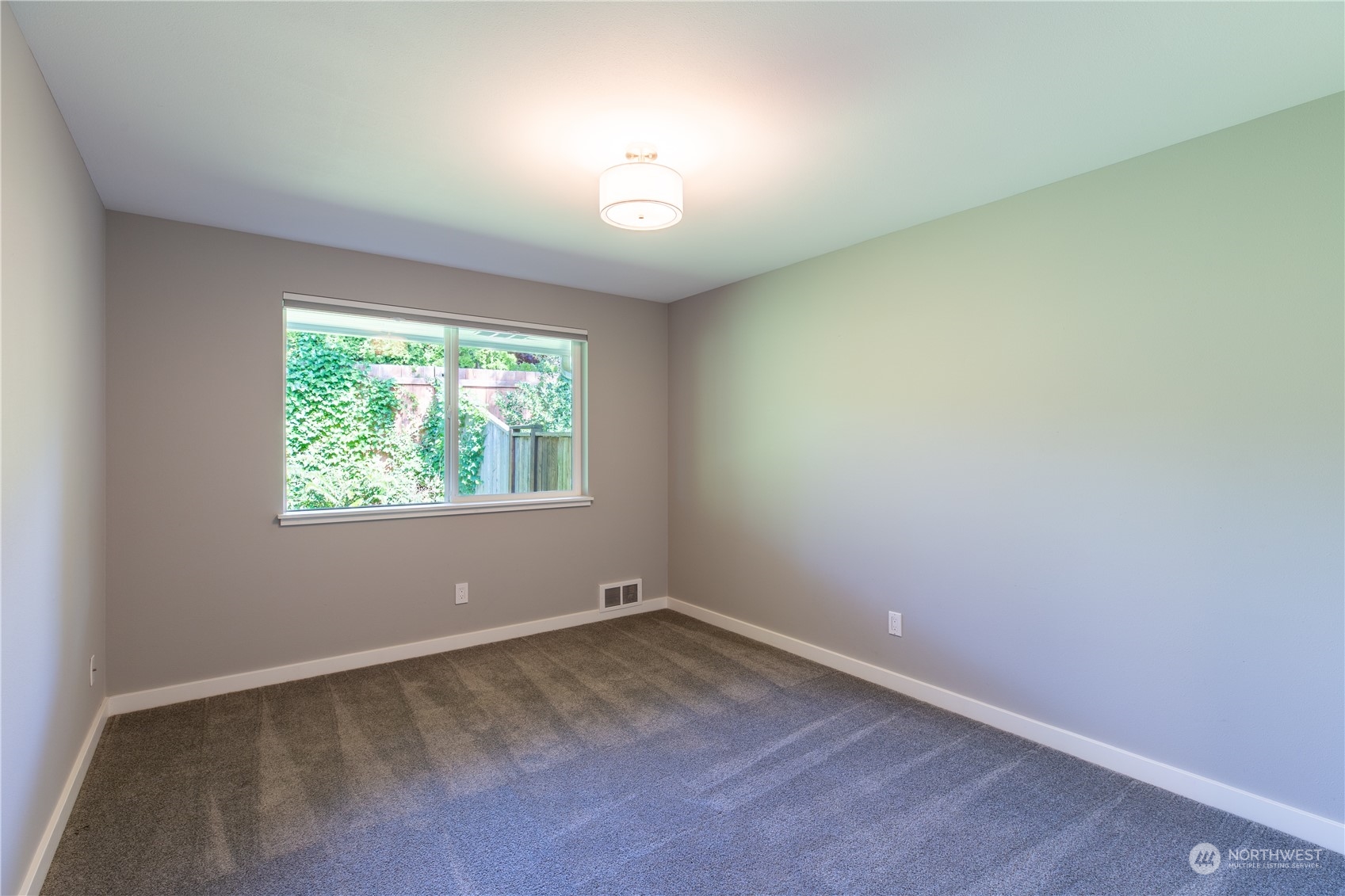 8498 Talbot Road Edmonds, WA 98026 - Photo 22 of 30 an empty room with a window