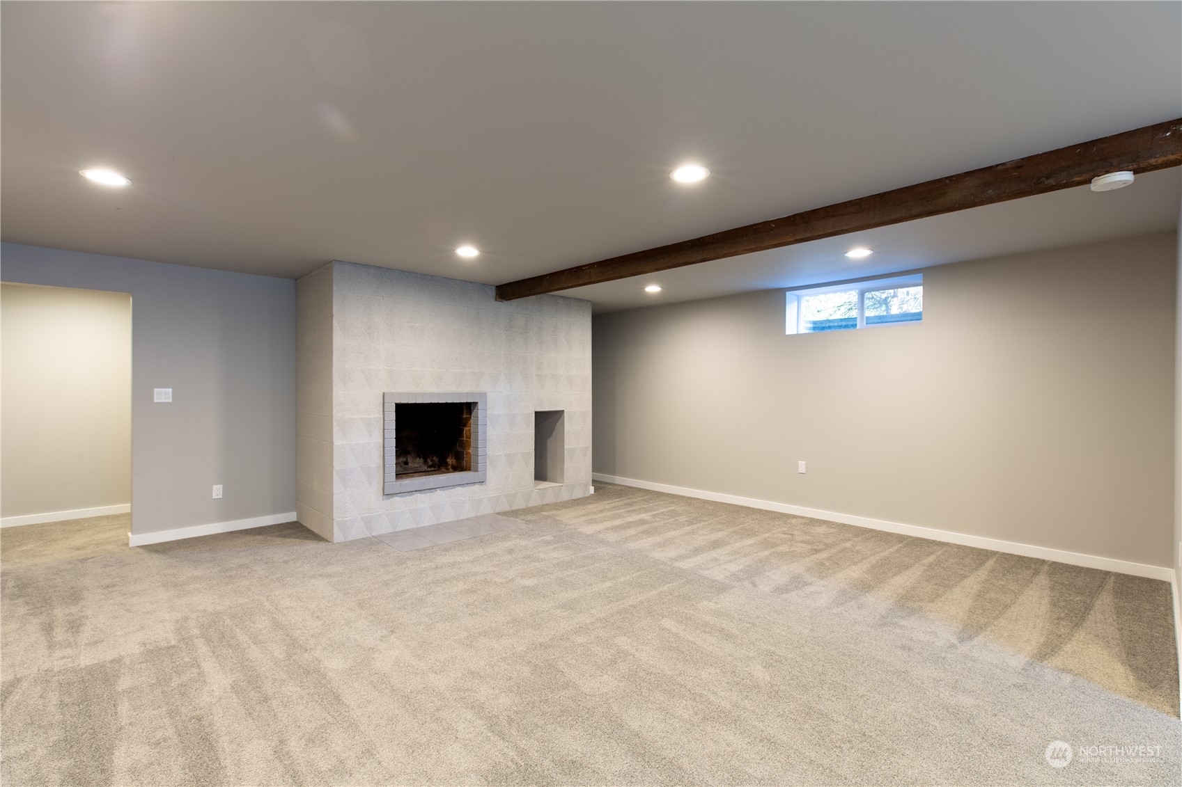 8498 Talbot Road Edmonds, WA 98026 - Photo 24 of 30 a view of an empty room with a fireplace