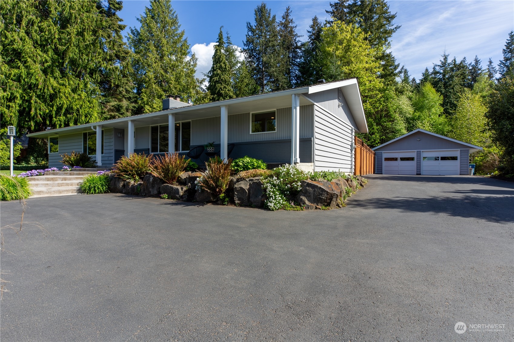 8498 Talbot Road Edmonds, WA 98026 - Photo 25 of 30 front view of a house with a yard and a table