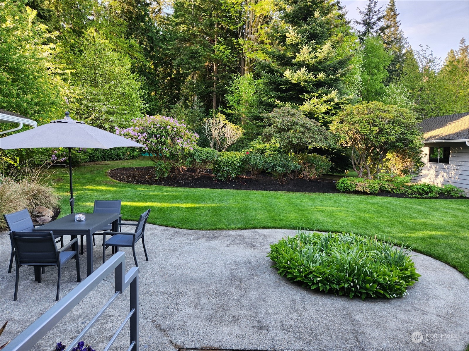 8498 Talbot Road Edmonds, WA 98026 - Photo 28 of 30 a view of yard with seating area and green space