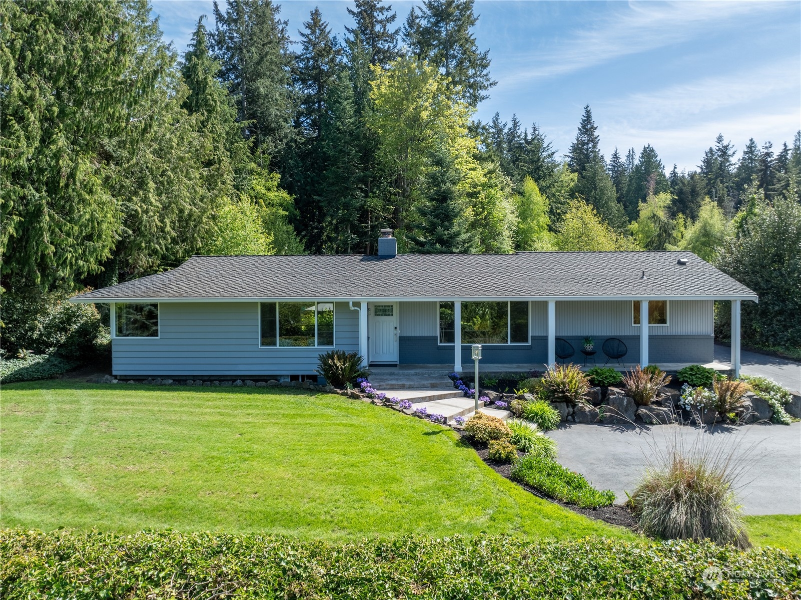 8498 Talbot Road Edmonds, WA 98026 - Photo 4 of 30 a view of a house with garden and a patio