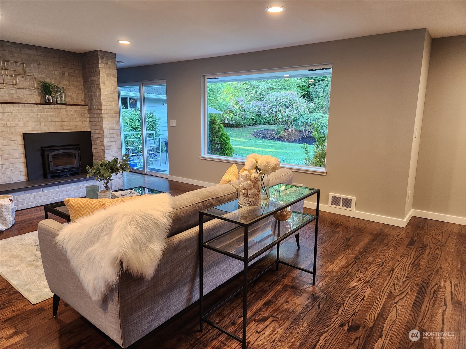 8498 Talbot Road Edmonds, WA 98026 - Photo 10 of 30 a living room with furniture and a fireplace