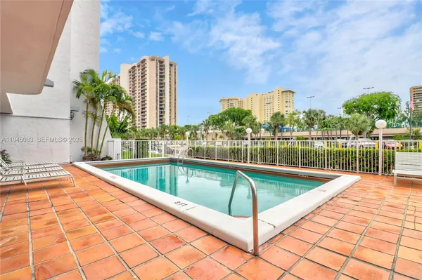 a view of a swimming pool with a lounge chairs