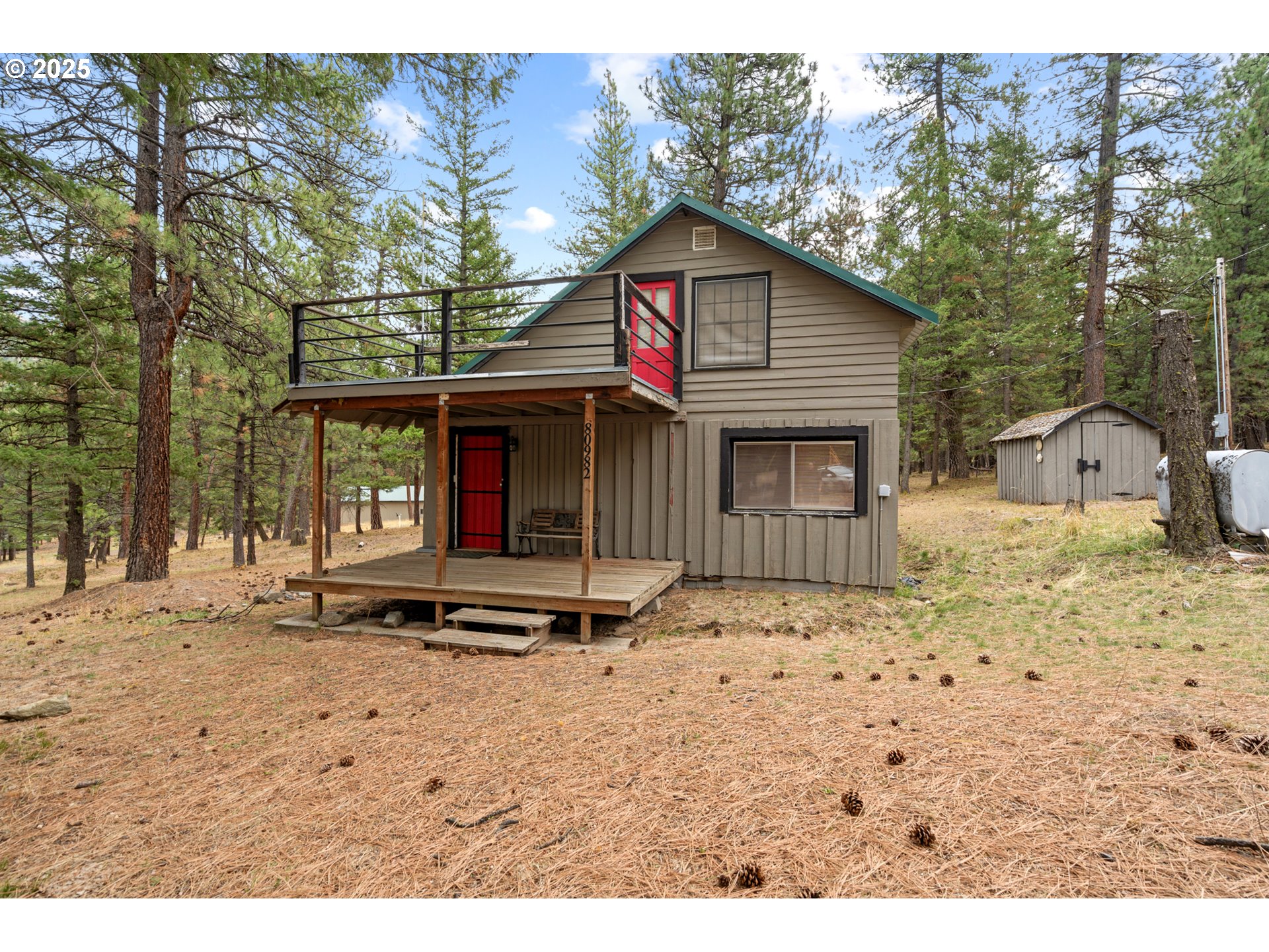 80982 Cougar Lane Heppner, OR 97836 - Photo 2 of 46 a front view of a house with a yard and garage