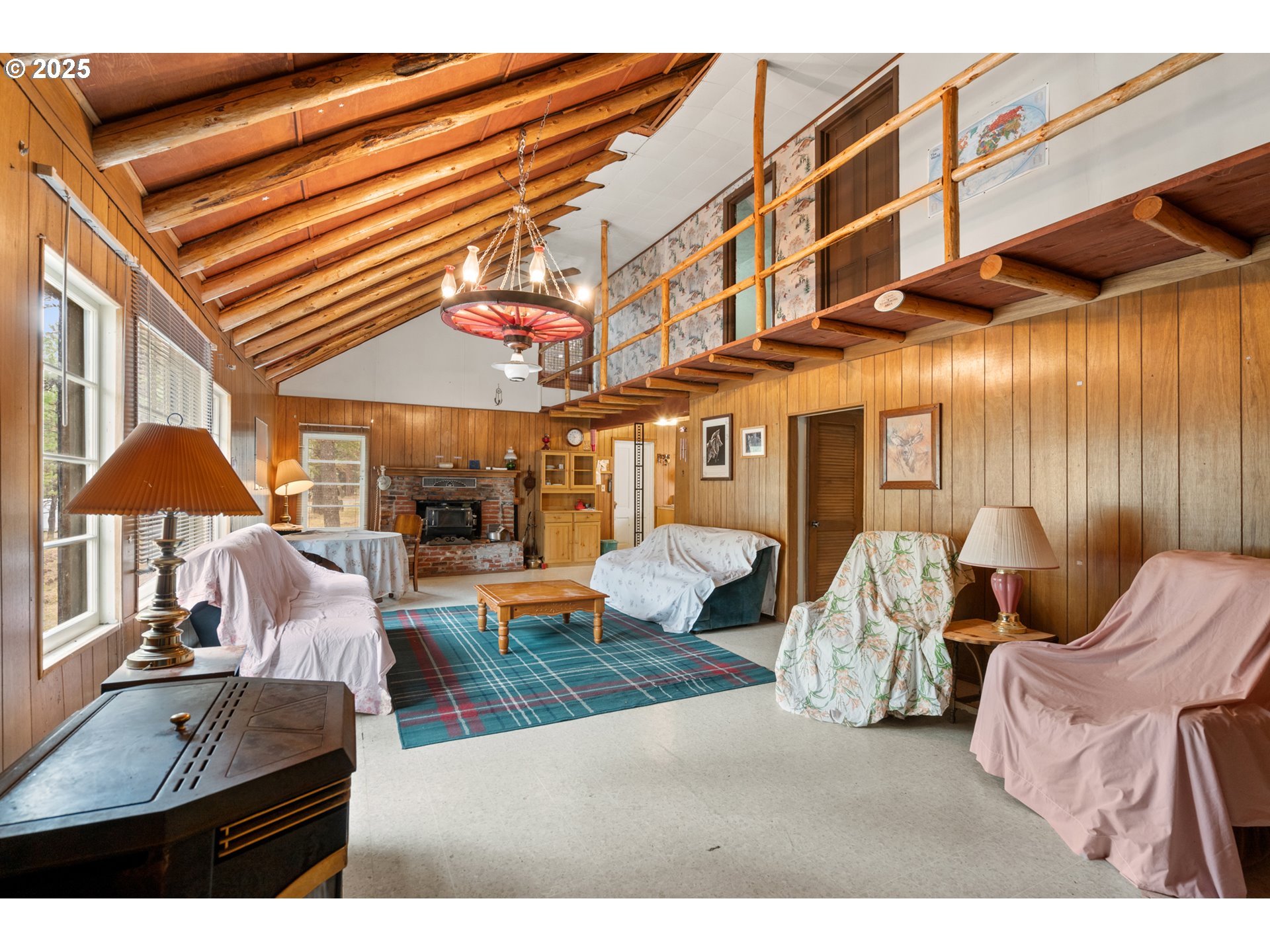 80982 Cougar Lane Heppner, OR 97836 - Photo 4 of 46 a view of a patio with couches and table and chairs under an umbrella