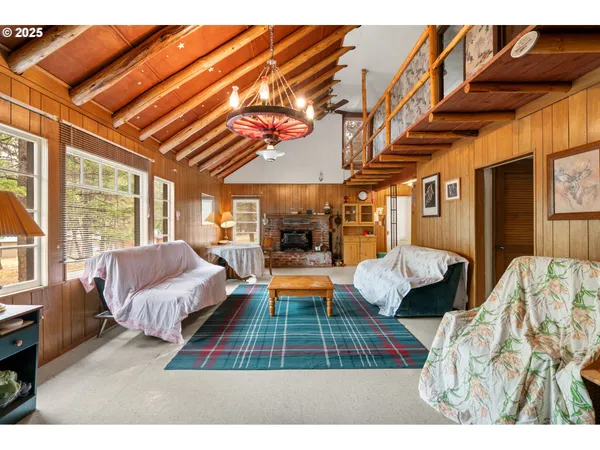 a room with furniture and a chandelier