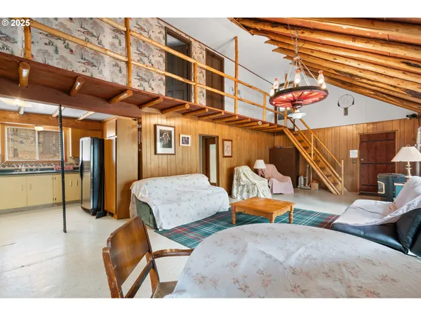 a bedroom with furniture and a walk in closet