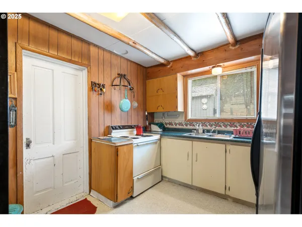 a kitchen with stainless steel appliances granite countertop a stove and a sink