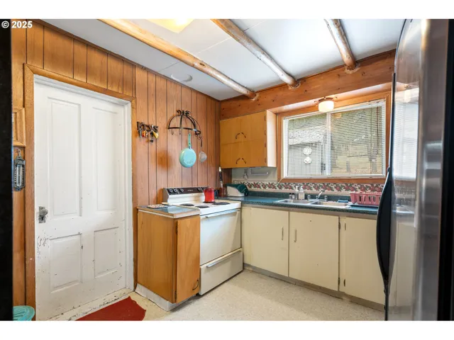 a kitchen with stainless steel appliances granite countertop a stove and a sink