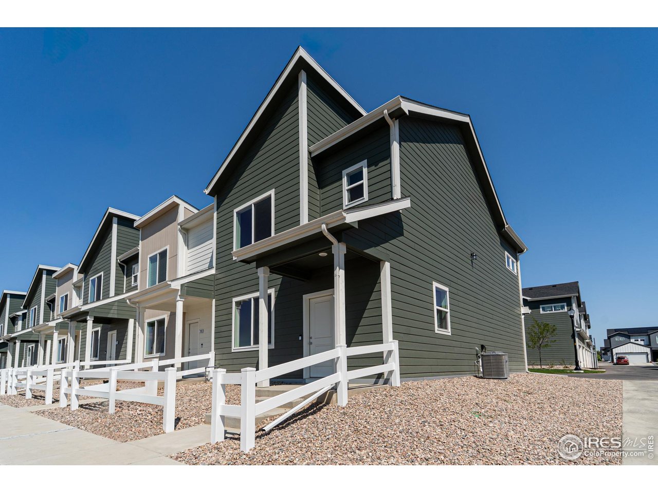 3748 Pinnacles Court Evans, CO 80620 - Photo 1 of 14 a front view of a house with a porch