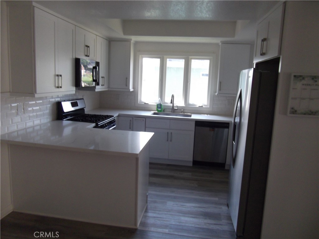 34152 Crystal Lantern Dana Point, CA 92629 - Photo 2 of 21 a kitchen with stainless steel appliances a sink stove and refrigerator