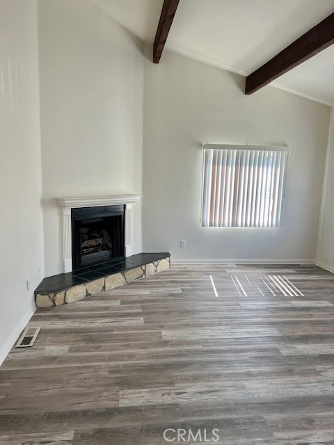 34152 Crystal Lantern Dana Point, CA 92629 - Photo 4 of 21 a view of empty room with fireplace and wooden floor