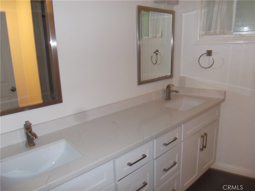 34152 Crystal Lantern Dana Point, CA 92629 - Photo 8 of 21 a bathroom with a sink and a mirror