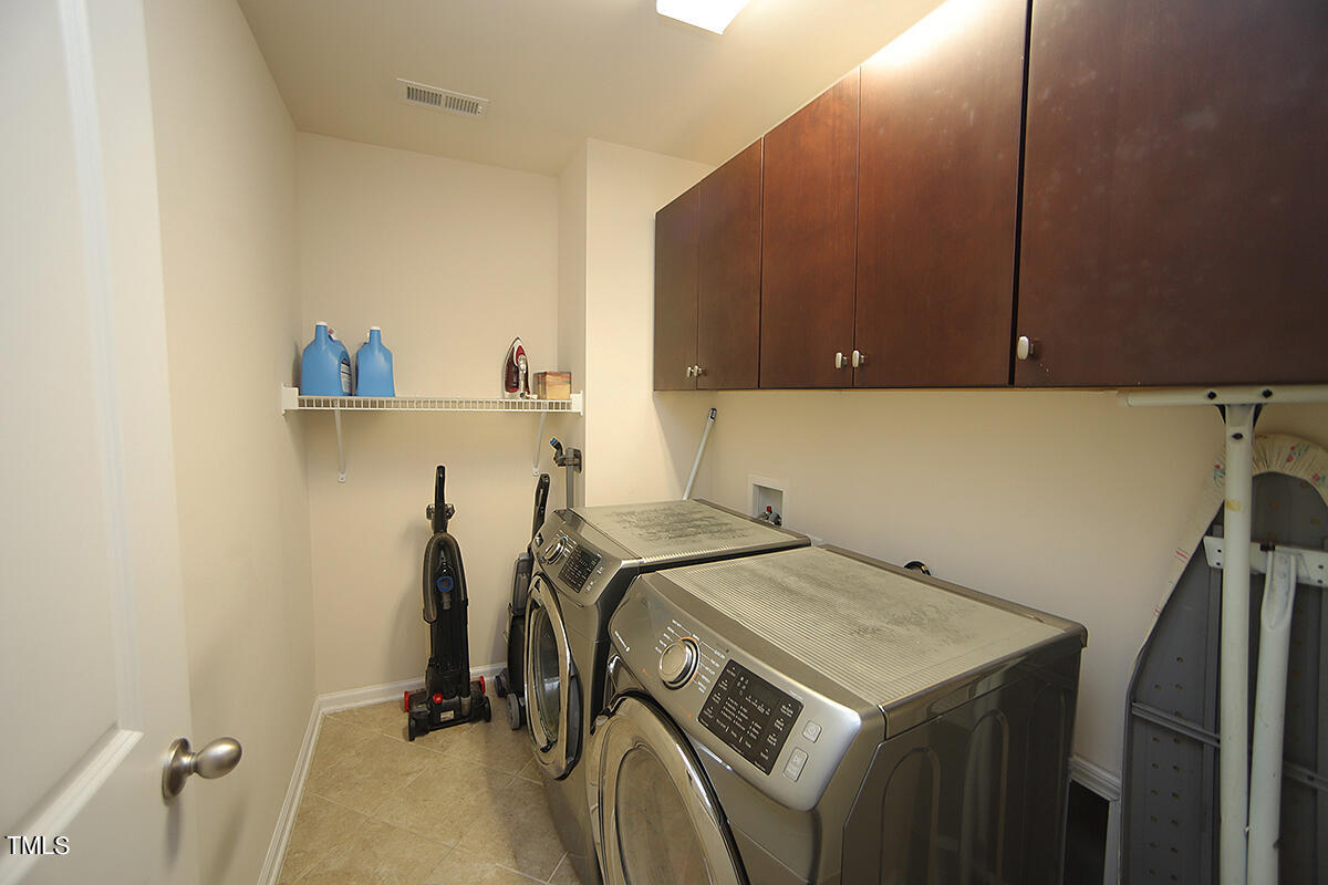 739 McRae Road Cary, NC 27519 - Photo 17 of 24 Laundry Room with washer and dryer that convey