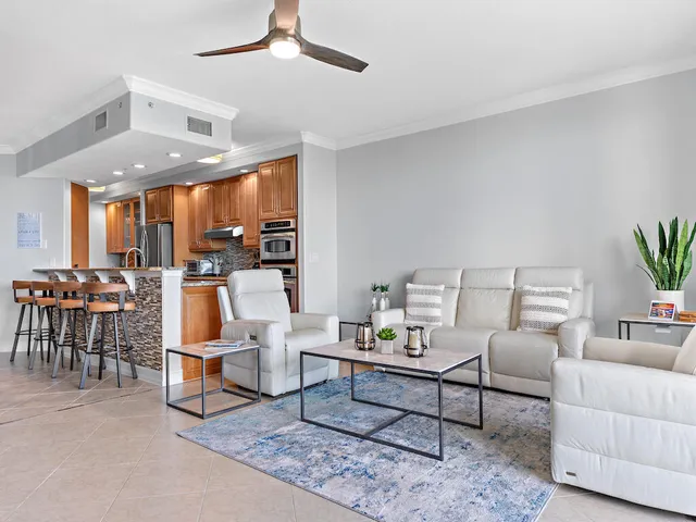 a living room with furniture and white walls