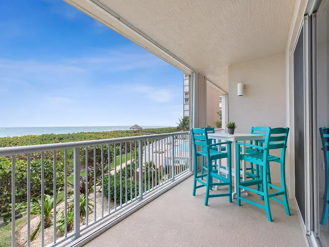 a view of balcony with furniture