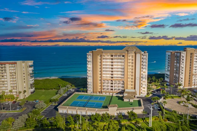 a view of a balcony with couches and wooden floor