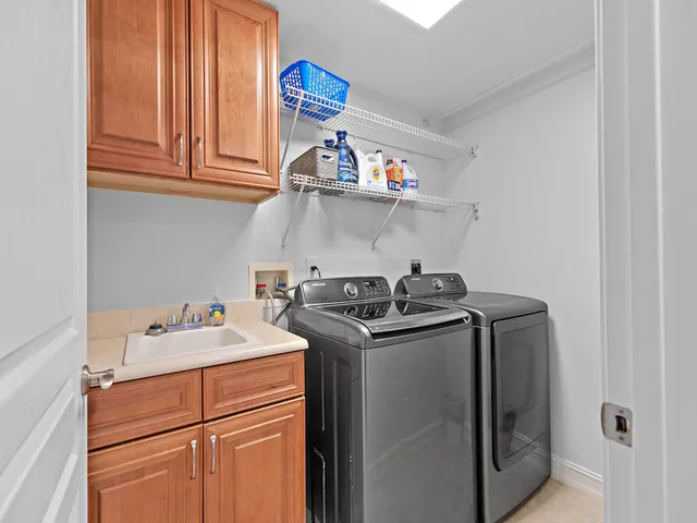 a view of a patio with a dining table and chairs with a fire pit