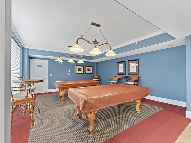 a view of a living room and a room with windows