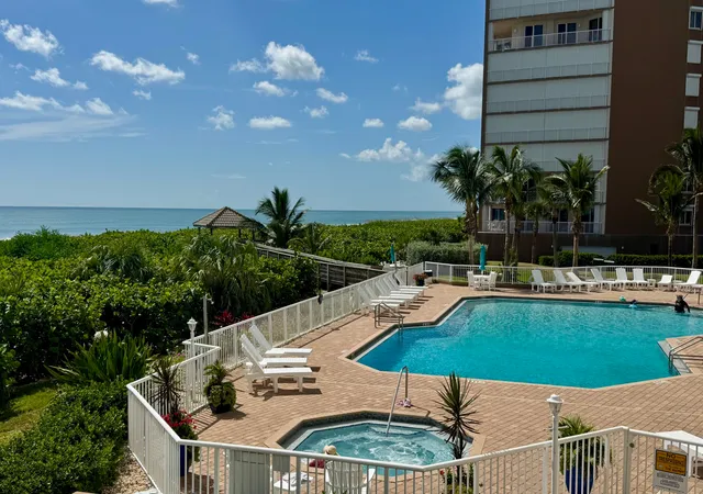 a view of a swimming pool with a patio