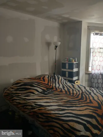 a view of room with a floor to ceiling window and closet