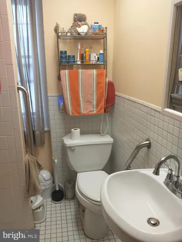 a bathroom with a sink and toilet