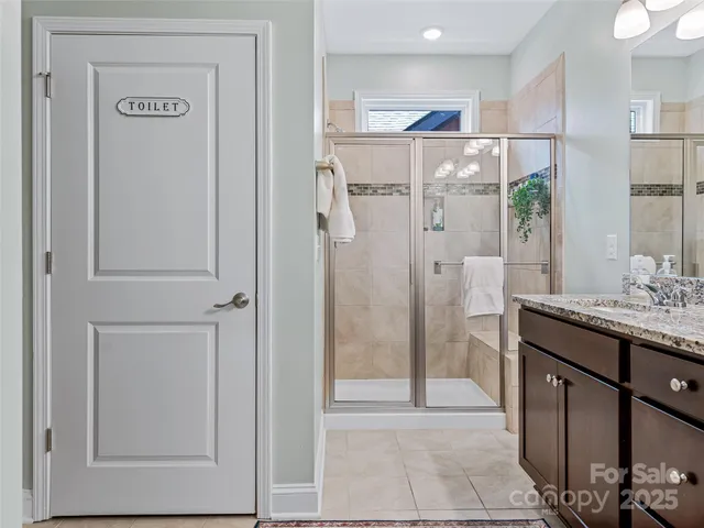 a bathroom with a shower and a sink