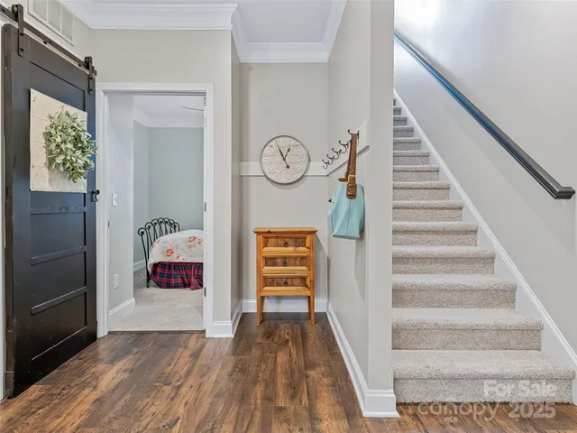 a view of entryway with wooden floor