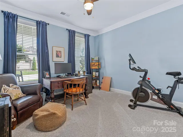 a bathroom with a granite countertop sink and a toilet