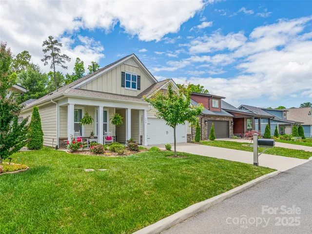 a front view of a house with garden and porch