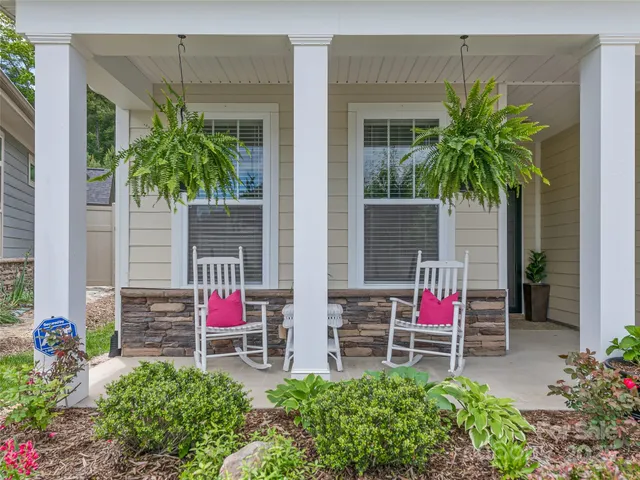 a house with lots of trees in front of it