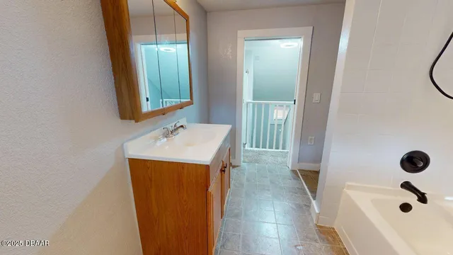 a bathroom with a sink a mirror and shower