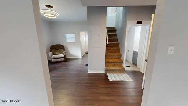 a view of livingroom with stairs and furniture