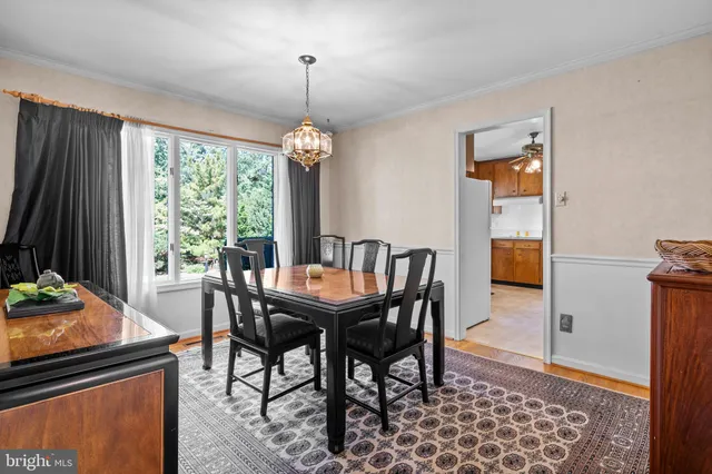 a view of entryway wooden floor and livingroom