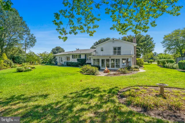a kitchen with stainless steel appliances a refrigerator and a stove top oven