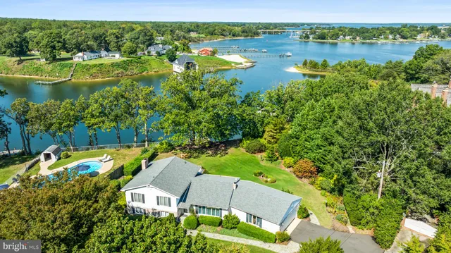 a living room with furniture a rug and a large window