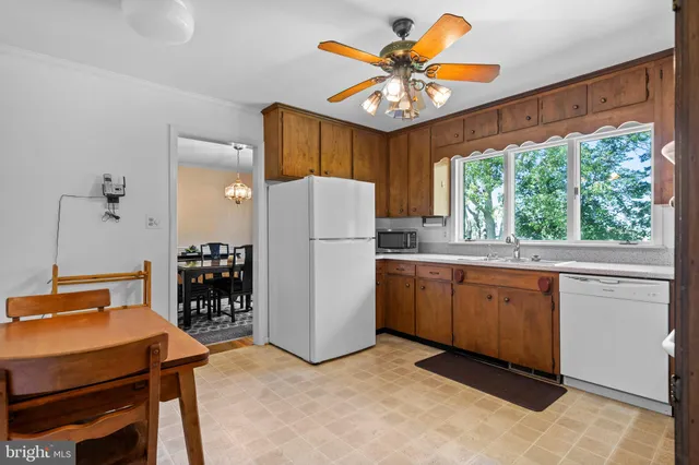 a view of a deck with wooden floor and fence