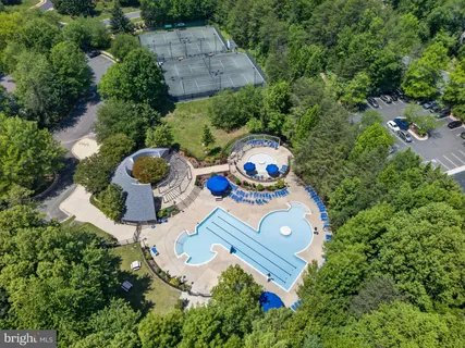 an aerial view of a house with outdoor space